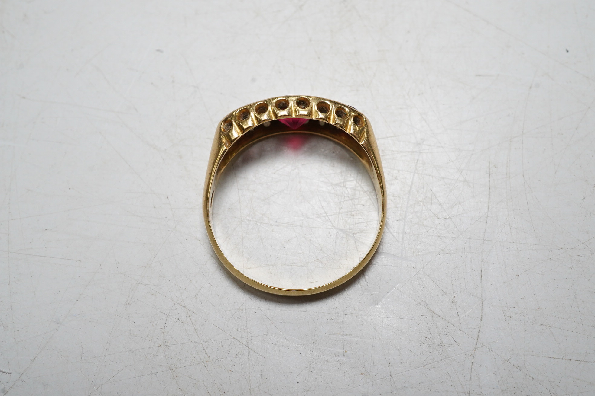 An 18ct gold, red doublet and diamond chip set dress ring, size N, gross 3 grams. Condition - poor.